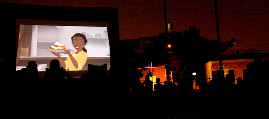 Families and friends gather watch "The Princess and the Frog" in Annunciation Square Park in August 2011. The showing drew about 150 people. (UptownMessenger.com file photo by Sabree Hill)