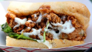 Palace Cafe's Oyster Rockefeller po-boy at the 2011 Oak Street Po-Boy Festival. (UptownMessenger.com file photo by Sabree Hill)