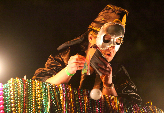 A Krewe of Morpheus parader passes out throws from the top of a float. (Sabree Hill, UptownMessenger.com)