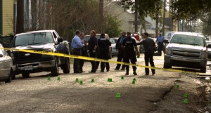Police officers stand amid shell casings marking the scene of a fatal shooting on Chippewa Street in the Irish Channel on Feb. 21, 2013. (UptownMessenger.com file photo by Robert Morris)