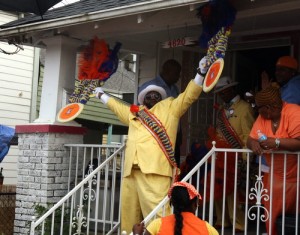Erone Hymel emerges from his mother's house on Loyola Avenue at the beginning of the Uptown Swingers second line on June 24, 2013. (UptownMessenger.com file photo by Robert Morris)