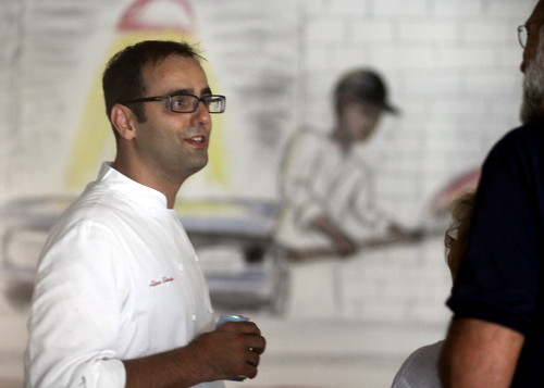 Dominica chef Alon Shaya chats with a neighbor of the proposed Magazine Street expansion. (Robert Morris, UptownMessenger.com)