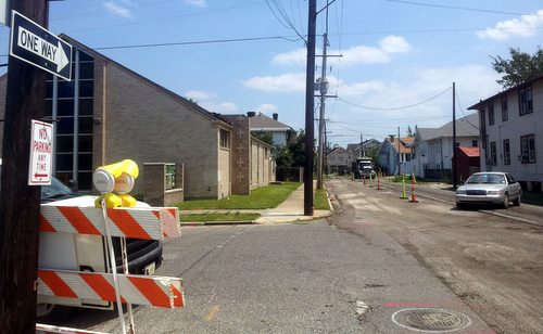 Signs on Freret Street at Marengo show that traffic is one-way in the downtown direction as road repaving begins. (Robert Morris, UptownMessenger.com)