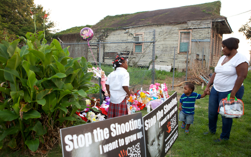 Crowds gather to leave stuffed animals at a memorial for Londyn Samuels Friday evening. (Sabree Hill, UptownMessenger.com)
