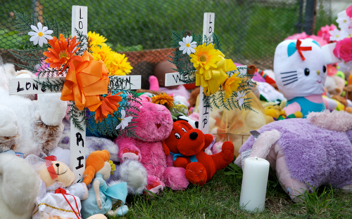 Stuffed animals form a memorial for Londyn Samuels. (Sabree Hill, UptownMessenger.com)