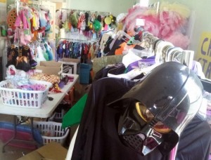 Racks of donated costumes fill the neighborhood center waiting to be handed out Tuesday. (Robert Morris, UptownMessenger.com)