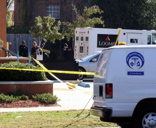 Police gather evidence at the crime scene. (Robert Morris, UptownMessenger.com)