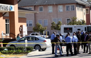 Investigators fill the parking lot of the Chase bank at Carrollton and Claiborne. (Robert Morris, UptownMessenger.com)