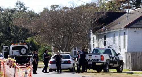 Police officers guard a large SUV found in the 1700 block of Adams. (Robert Morris, UptownMessenger.com)