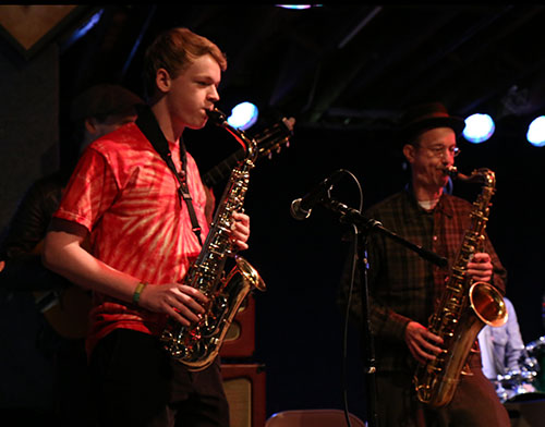 Garland Bergeron (left) plays "Little Liza Jane" with the Little Big Horns' saxophonist Craig Flory (right).