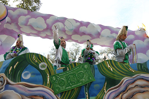 Rider throws beads on Napoleon Ave. Pontchartrain's 2014 theme was "What's Eating New Orleans." (Zach Brien, UptownMessenger.com)