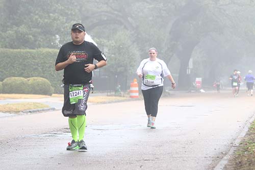 Participants make their way towards downtown on St. Charles ave.