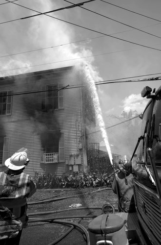 Firefighters battle a blaze on Valmont Street. (photo courtesy of Bob Perrin)