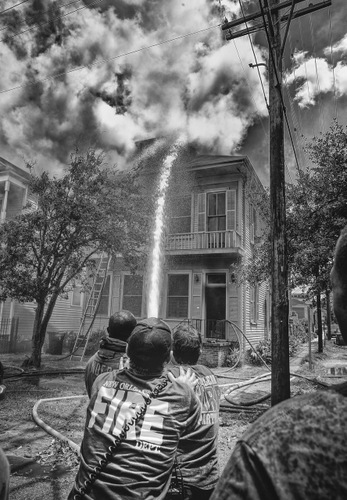 Firefighters battle a blaze on Camp Street on Monday afternoon. (photo courtesy of Bob Perrin)