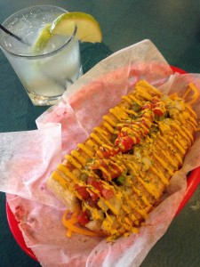 Dat Dog's Alligator Sausage and a Caipirinha, the national drink of Brazil. Both are available at Dat Dog this week during World Cup games.