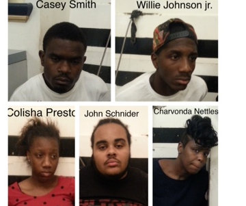 Five suspects charged with driving around the Central Business District and shooting four homeless people with pellet guns. (images via NOPD)