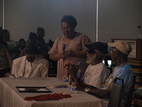 Roslyn J. Smith, center, mediates the conversation with the elders. The elders presented were Herbert Gettridge, far left, Joseph Jenkins, middle, and Isaac Edwards, near right. (Zach Brien, UptownMessenger.com)