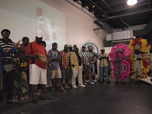 Gang flags and flag boys gathered on stage at Sunday's ceremony. (Zach Brien, UptownMessenger.com)