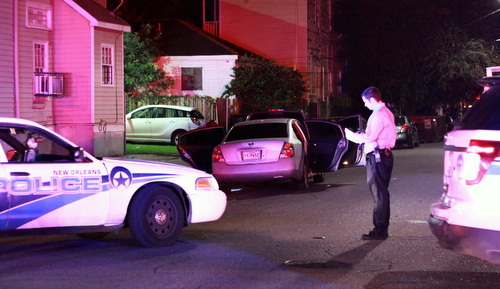 Police investigate a shooting at the corner of Baronne and Second Streets late Friday. (Robert Morris, UptownMessenger.com)