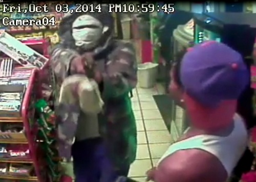 An image from surveillance video shows the armed robbery Friday night of the Discount Corner gas station on South Claiborne. (via NOPD)