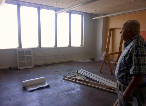Lusher Charter School operations director Frank Israel checks on a classroom under renovation at the Freret campus in late October. (Robert Morris, UptownMessenger.com)