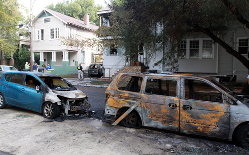 Cars across the street were also set ablaze in the Nov. 6 fire that displaced two families at the corner of Prytania and Constantinople. (Robert Morris, UptownMessenger.com)
