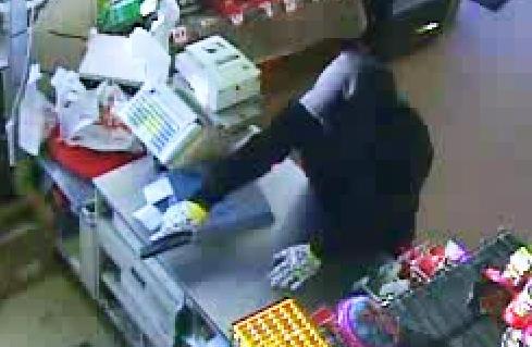 An image from Sunday morning's armed robbery of the Family Dollar on South Claiborne. (via NOPD)