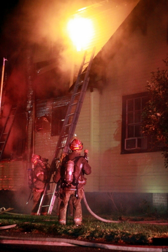 Firefighters battle a blaze in Broadmoor. (UptownMessenger.com)