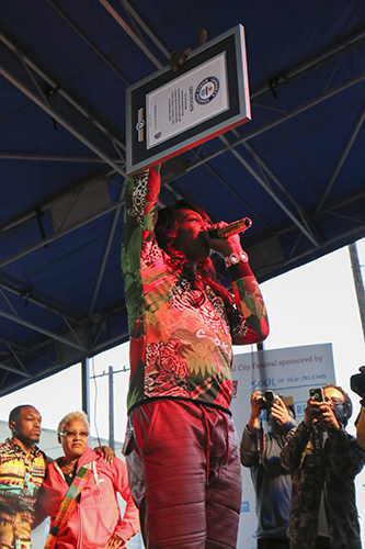 Big Freedia holds up her World Record plaque. (Zach Brien, UptownMessenger.com)