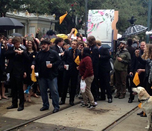 The memorial procession for late comedian and activist Jonah Bascle confronts a street car on St. Charles and Valence Street (Jamal Melancon, Uptown Messenger.com)