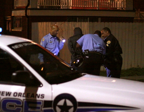 New Orleans police officers take a suspect into custody at the corner of Cadiz and Loyola streets during a two-hour manhunt in the area Sunday evening following a rash of Uptown robberies. (Robert Morris, UptownMessenger.com)