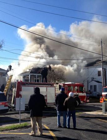 Smoke billows from a house on Constance Street as firefighters battle a blaze there. (Reader submitted photo by Louise Fenton)