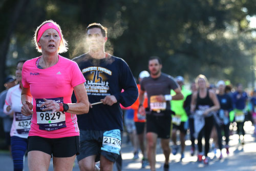 Maggie Randriamamonjy from San Francisco runs the half marathon down St. Charles avenue on Sunday morning. (Zach Brien, UptownMessenger.com)