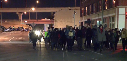 New Orleans police officers close an Interstate 10 on-ramp to divert protesters marching in support of demonstrations in Ferguson, Mo., on Nov. 25, 2014. (image via WWL-TV)