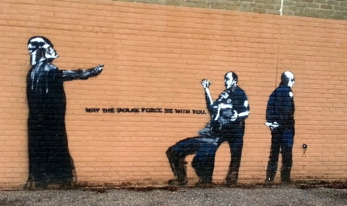 A politically-themed stencil on the side of the Priestley gym, by a street artist known as ‘Az.’ (Robert Morris, UptownMessenger.com)