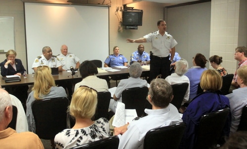 NOPD Commander Paul Noel gestures toward City Councilwoman Susan Guidry and NOPD Chief Michael Harrison during an anti-crime meeting Tuesday night at Touro Infirmary. (Robert Morris, UptownMessenger.com)