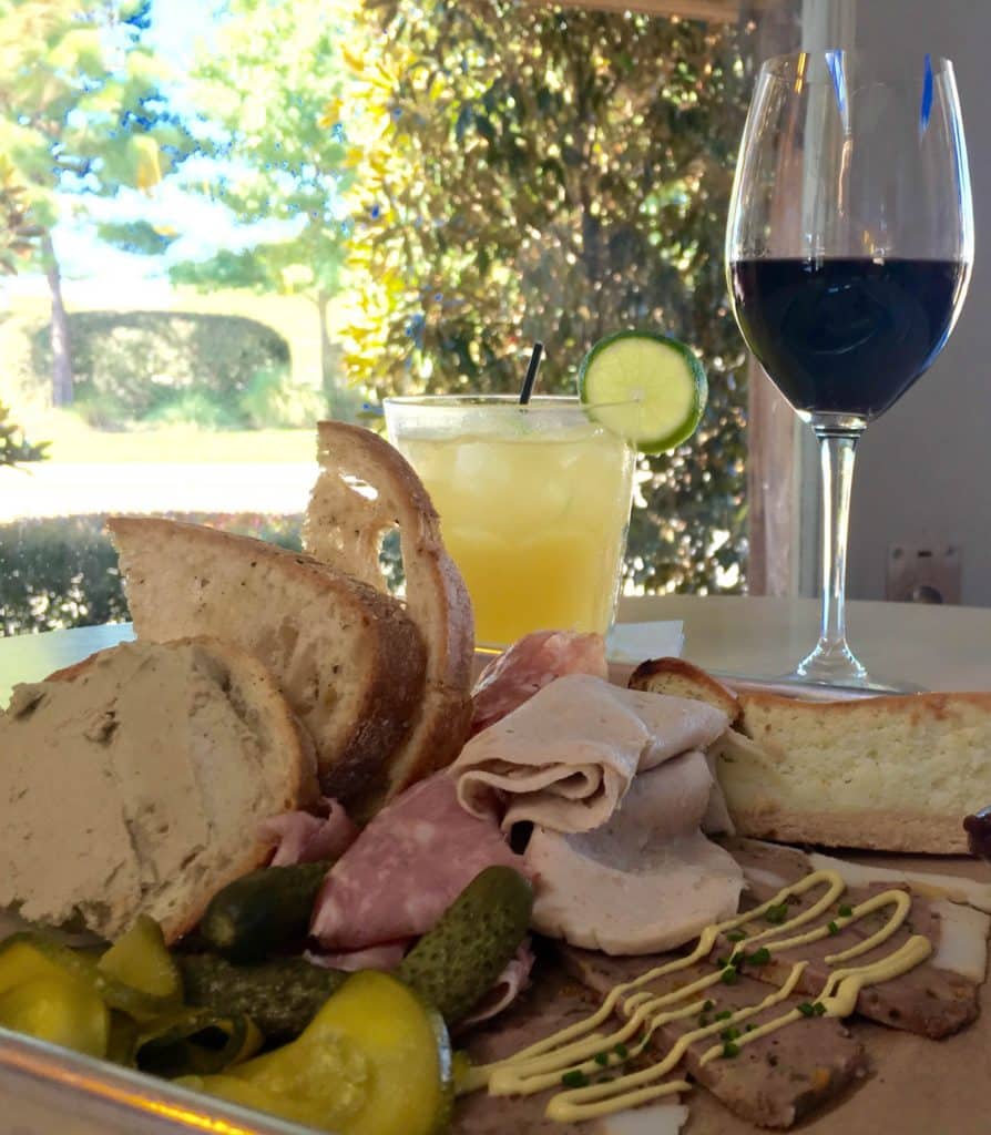 Charcuterie Board of Duck Liver Mousse, Lamb Terrine, Bavarian Gelb, Roquefort Cheesecake, Salami, Thomasville Cheese, and Zucchini Pickles (Kristine Froeba)