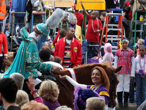 Ladders form a backdrop to the Krewe of Proteus on Napoleon Avenue in 2012. A proposed new law would require all ladders be six feet back from the curb. (UptownMessenger.com file photo by Robert Morris)