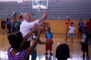 Mayor Landrieu shoots baskets in the rebuilt Lyons Center gym at the reopening ceremony in June 2013. (UptownMessenger.com file photo by Robert Morris)