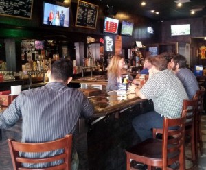 Patrons line the bar for a Fat Harry's lunch on Friday afternoon. (Robert Morris, UptownMessenger.com)