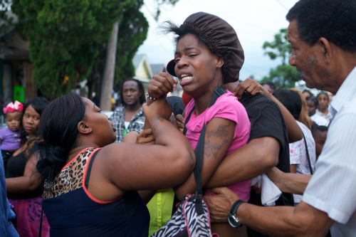 Tracey Moffet screams with pain before passing out at the vigil for Arabian Gayles. (Sabree Hill, UptownMessenger.com)