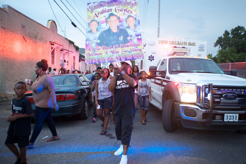 Friends, family and community leaders march during the vigil. (Sabree Hill, UptownMessenger.com)