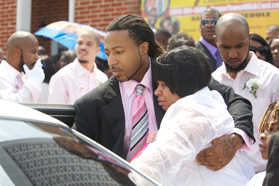 Ashley Moffet, mother of Arabian Gayles,  leaves her daughters funeral.  (Sabree Hill, UptownMessenger.com)