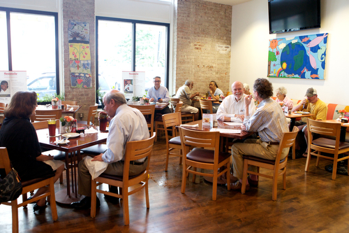Guests enjoy lunch at Cafe Reconcile Thursday afternoon. (Sabree Hill, UptownMessenger.com)
