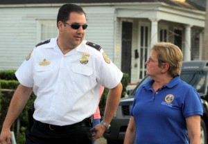 NOPD Second District Commander Paul Noel talks to City Councilwoman Susan Guidry during Wednesday's anti-crime march. Guidry chairs the criminal-justice committee that held Wednesday's hearings on NOPD staffing. (Sabree Hill, UptownMessenger.com)