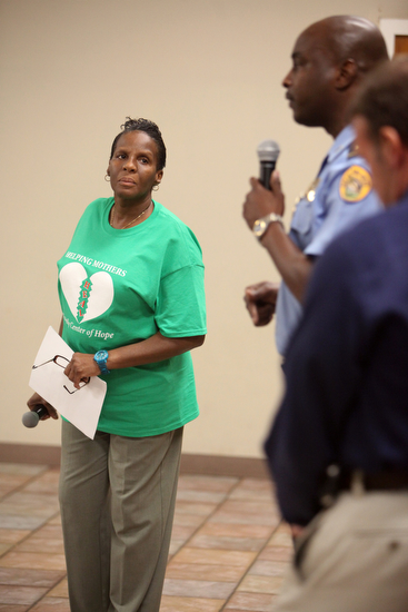 Cathy Rogers listens as NOPD Lt. Shaun Ferguson addresses a question asked about how cold cases are handled. (Sabree Hill, UptownMessenger.com)