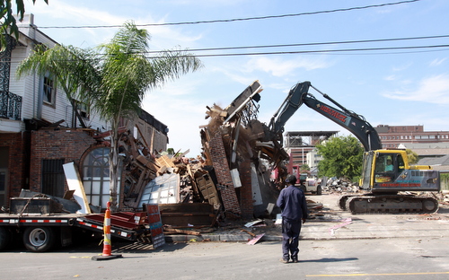 Demolition workers push over a wall of the former Frank's Steakhouse on Freret Street on Wednesday. (Robert Morris, UptownMessenger.com)