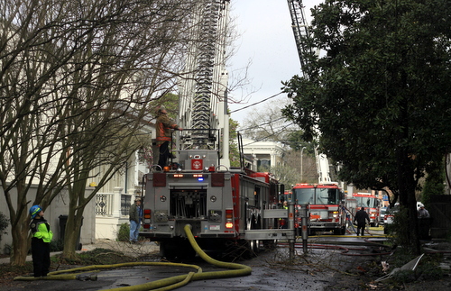 Ladder trucks line Chestnut Street to fight the fire.  (Robert Morris, UptownMessenger.com)