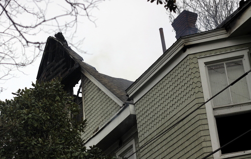 Missing portions of the roof can be seen against the sky after the fire.  (Robert Morris, UptownMessenger.com)