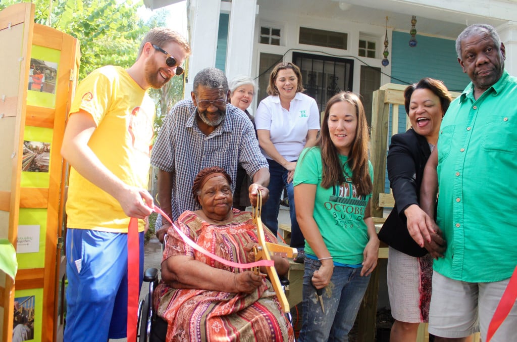 Homeowners of 1823 Cadiz St. cut the ribbon to their new wheelchair ramp built by volunteers from Shell and Junior League of New Orleans.